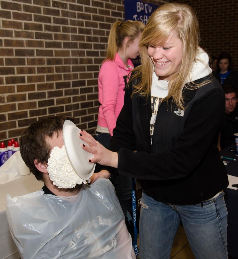 GVL/Bo AndersonStacie Stuut hits Brennan Gorman, Vice President of Campus Affairs, in the face with a cream pie during Pie a Senator