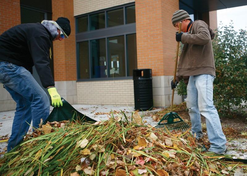 GVL / Eric CoulterCollin DeHaan and Josh Shroedter clean up clippings from the Connection