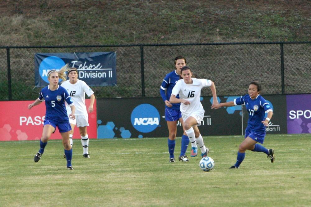 GVL / Eric CoulterAlyssa Mira fights off two UCSD athletes to move the ball up the field. Despite the comeback attempt of the Lakers, their season ended on Thursday with a 2-1 loss against the University of California San Diego. 