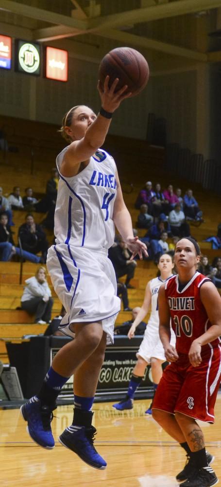GVL/Bo AndersonKat LaPrairie goes up for a layup during the first half of Mondays season opener.