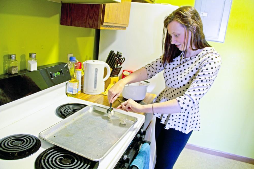 Megan Sinderson/ GVLChanon Cummings baking cookies in her kitchen in the Grand Valley Apartments.
