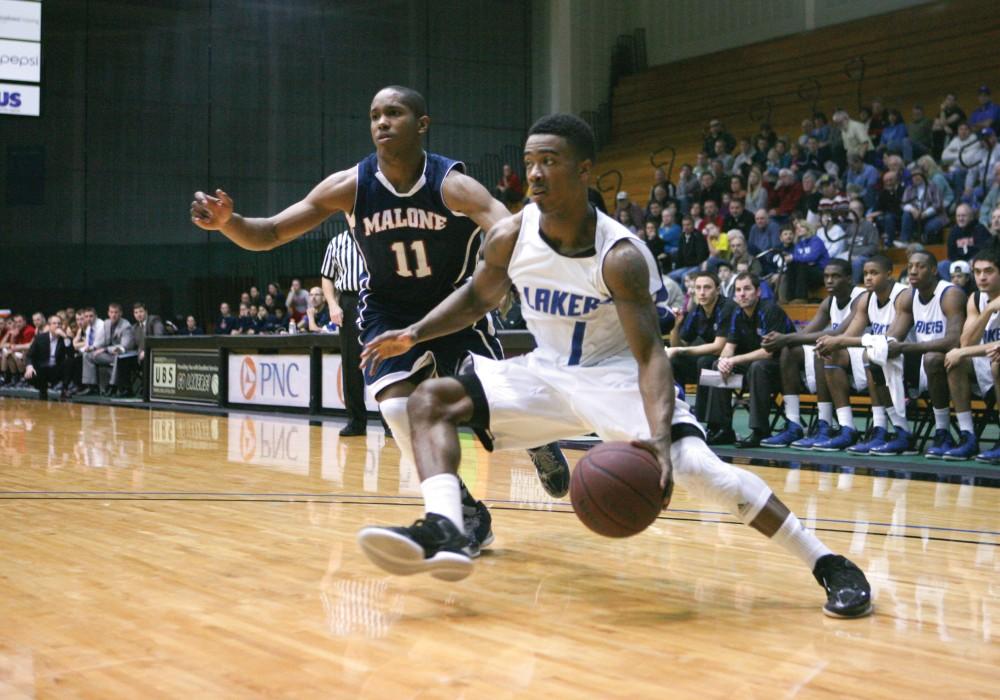 GVL / Eric CoulterBreland Hogan (1) drives the baseline against the Malone defender.