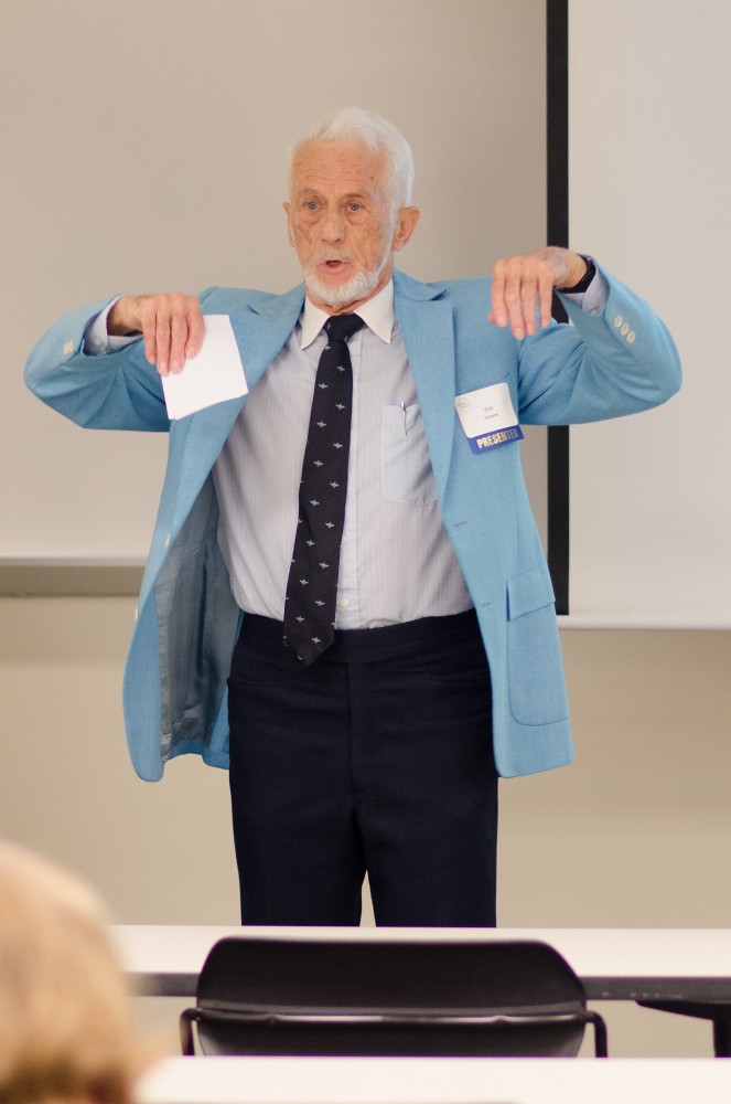 GVL/Bo AndersonRichard Graves, former Boston Marathon participant and currrent World Senior Games 100m dash runner, demonstrates stretching techniques during a presentation at the 8th Annual Art & Science of Aging Conference at GVSU.