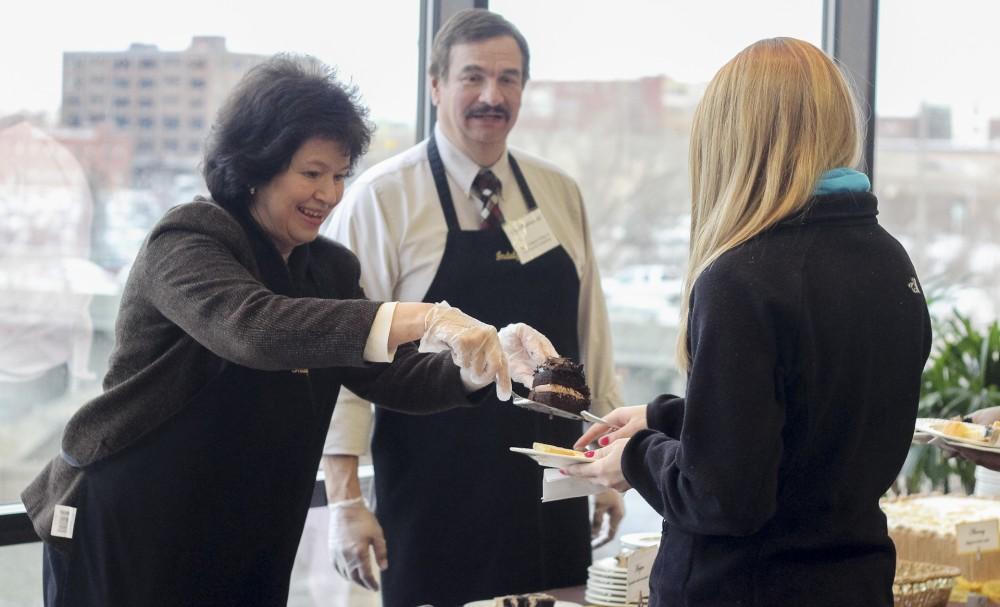 GVL/Jessica HollenbeckProvost Gail Davis helps serve chocolate cake during Indulge In a Cause.