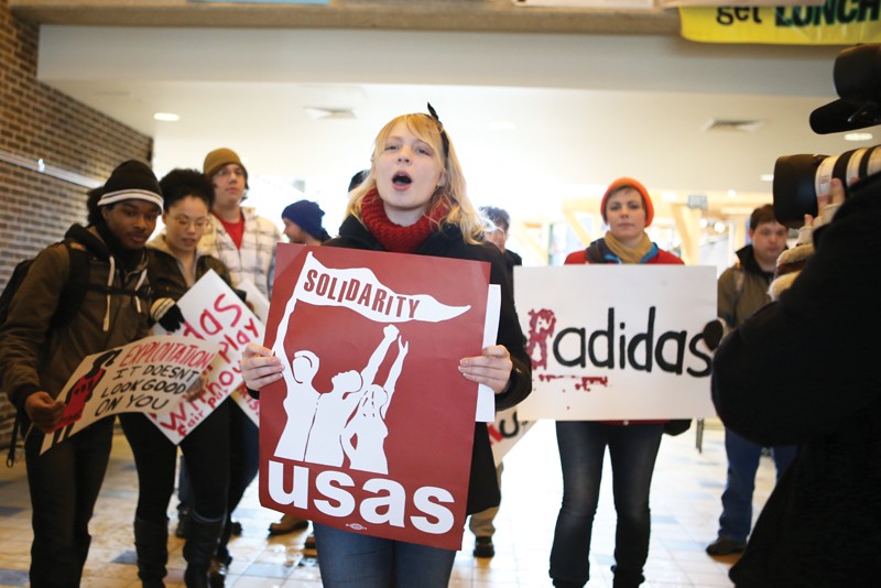 GVL / Robert MathewsMembers of the USAS organization march to the Provost office to protest GVSUs contract with Adidas. 