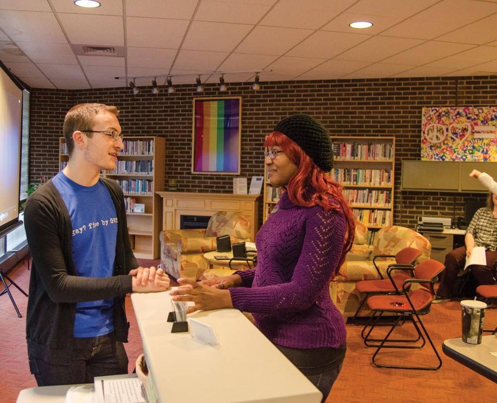 GVL/Jessica HollenbeckStaff members Anthony Clemons and Deva Hull speak in the LGBTQ resrouce center on Friday