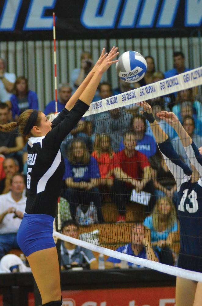 GVL / ArchiveNo. 12 Abby Aiken and No. 15 Kaleigh Lound block the ball against SMSU.