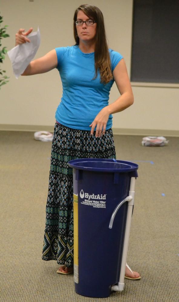 GVL / Hannah Mico. Colleen Condra, a senior who recently traveled to Tanzania, explains how HydrAid water filters will be installed and used in developing countries to help achieve a healthier society in Tanzania.