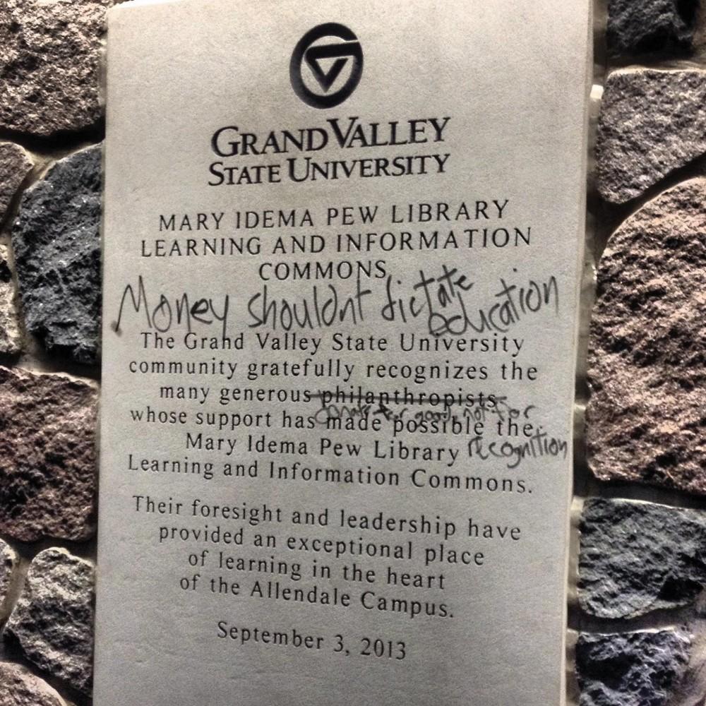 Courtesy / Ariel Mokdad
The graffiti on the commemorative plaque in the Mary Idema Pew Library entrance, found on Thursday morning.