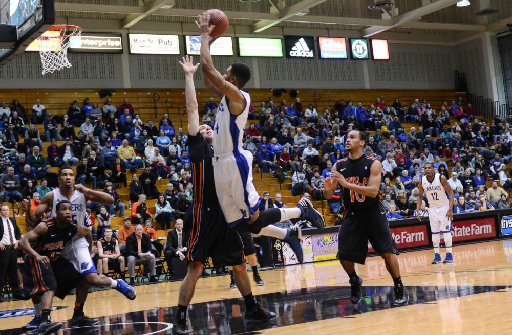 GVL / Hannah Mico. Junior Brandon Barkley leaps toward the basket in an attempt to score against Findlay University.