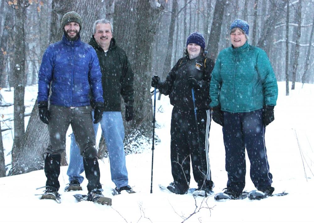 GVL / Laine Girard
(Far Left) Joe Bitely, A member of the OAC (Outdoor Adventure Center) staff, leads faculty & staff on a snowshoe adventure through Grand Valley's beautiful snow covered trails. 