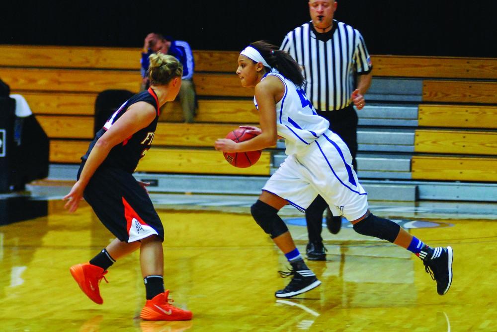 GVL / Hannah Mico. Senior guard Dani Candrall makes an offensive move against Findlay on Saturday.