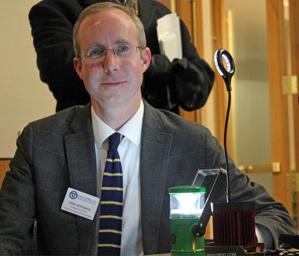 GVL / Gabrielle PattiDoctor Erik Nordman with the solar powered K-lantern and a led lightbulb lamp; both are examples of renewable energy at work.