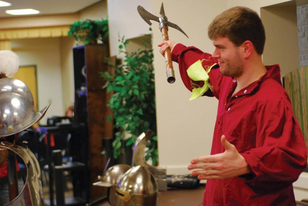 GVL / Hannah Mico. Michael Currie, junior, displays how a weapon might have been used by a middle-class knight in the renaissance era.