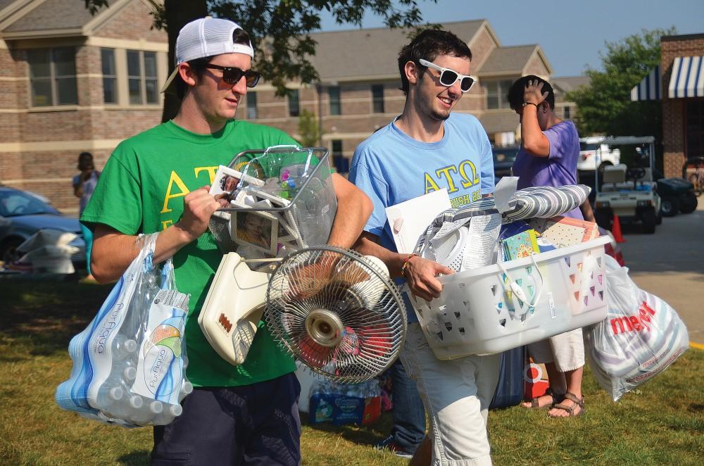 GVL/ ArchiveFormer students Kevin Newell and Tyler Dawson of Alpha Tau Omega help freshmen move into Kistler Living Center.