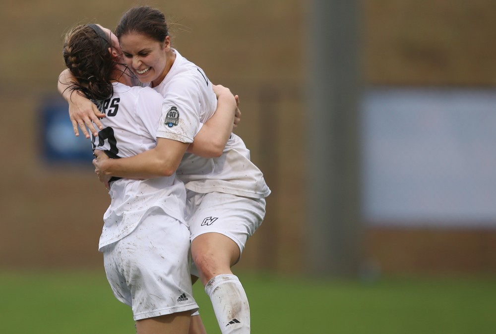GVL / Robert Mathews
Jenny Shaba (right) and Marti Corby (left) embrance after Shabas goal. 