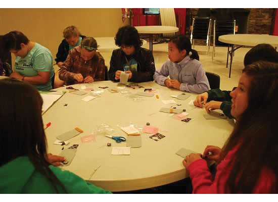 GVL / Audra Gamble
girl scout campers doing a STEAM (science, technology, engineering, arts and mathematics) project where they sewed circuits to make lightning bug jars that actually lit up