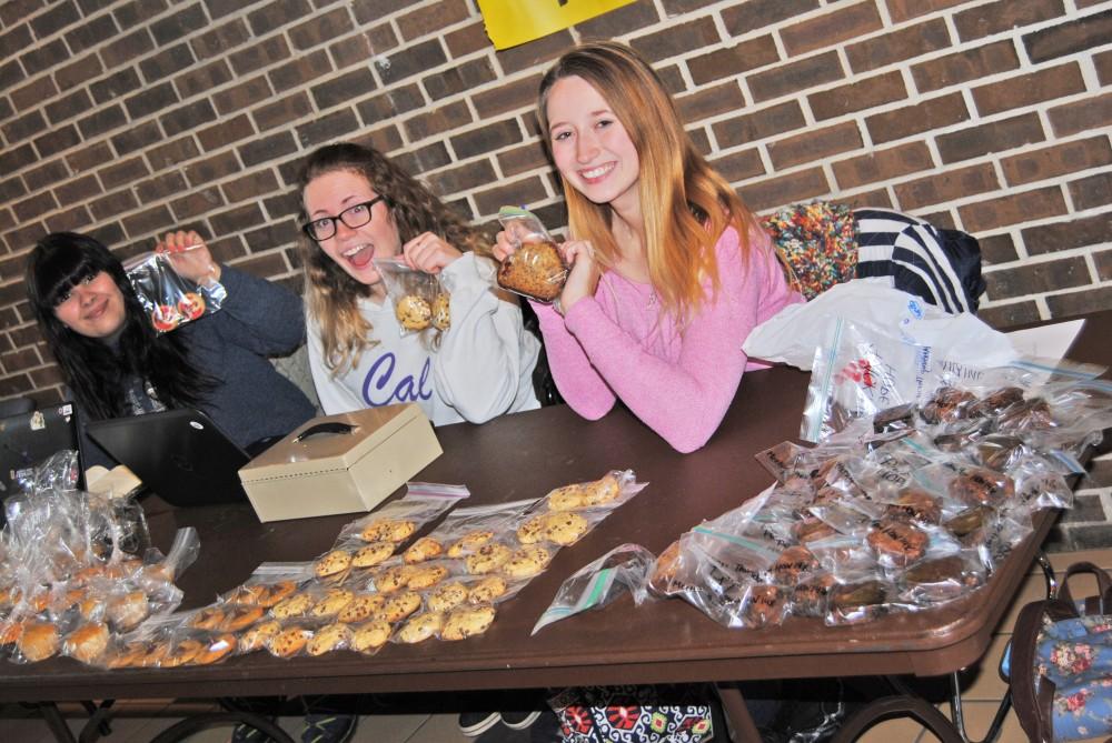GVL/Brianna OlsonErin ORourke, Kellie Abraham, Allyson Schomer of Packing Hope organizes a bake sale.