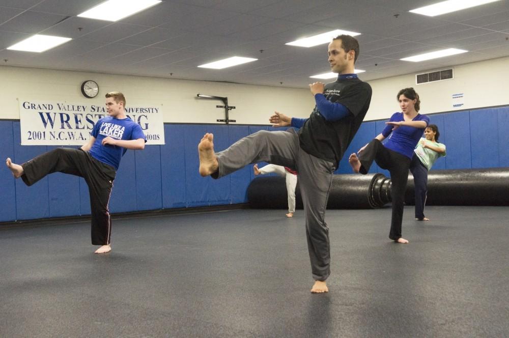 GVL/Lauren LoriaCapoeira Mandinga group members practice kicks