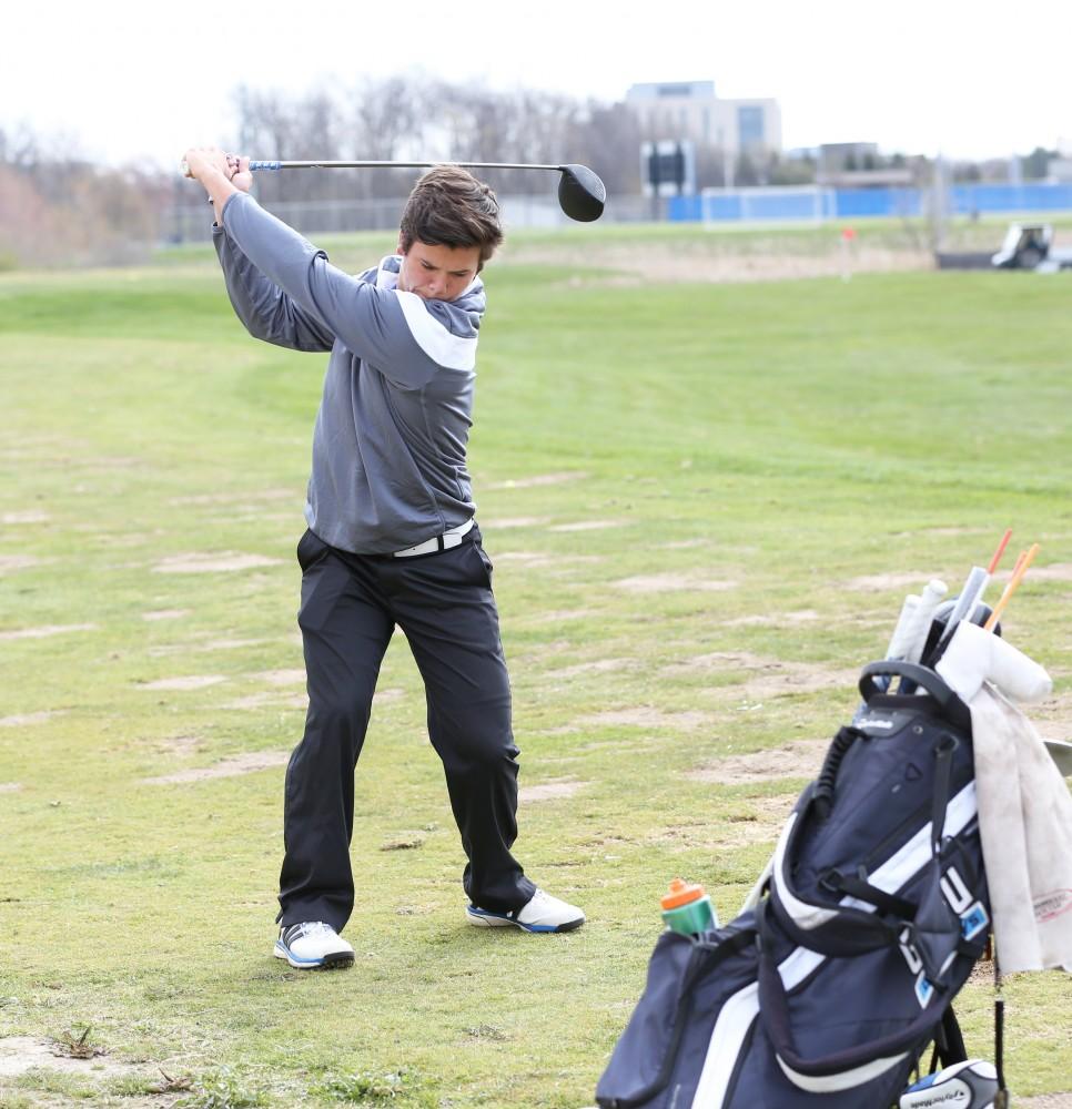 GVL/Kevin Sielaff
GLIAC Freshman of the Year in mens golf Domenic Mancinelli warms-up before a practice match at the Meadows Golf Course in Allendale Wednesday, April 29, 2015. 
