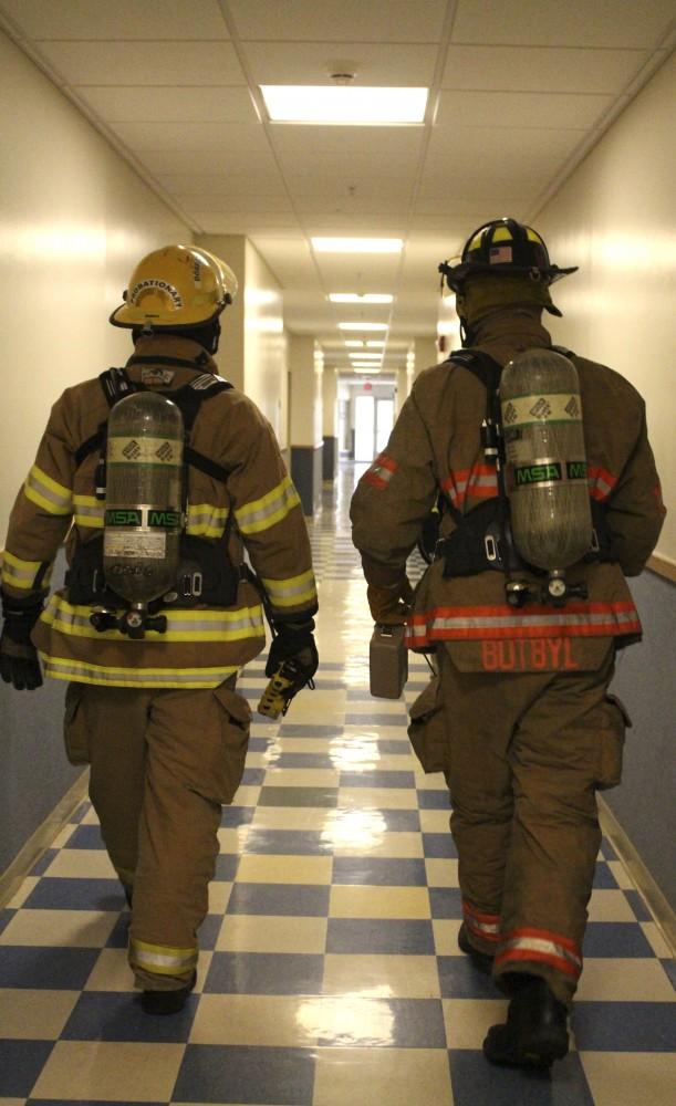 GVL/Audra Gamble 
Eleven different emergency response teams practice a radiology drill Tuesday, April 18, 2015 at Grand Valley State University's Allendale Campus. The drills tooks place within North B living center near the entrance to campus.  