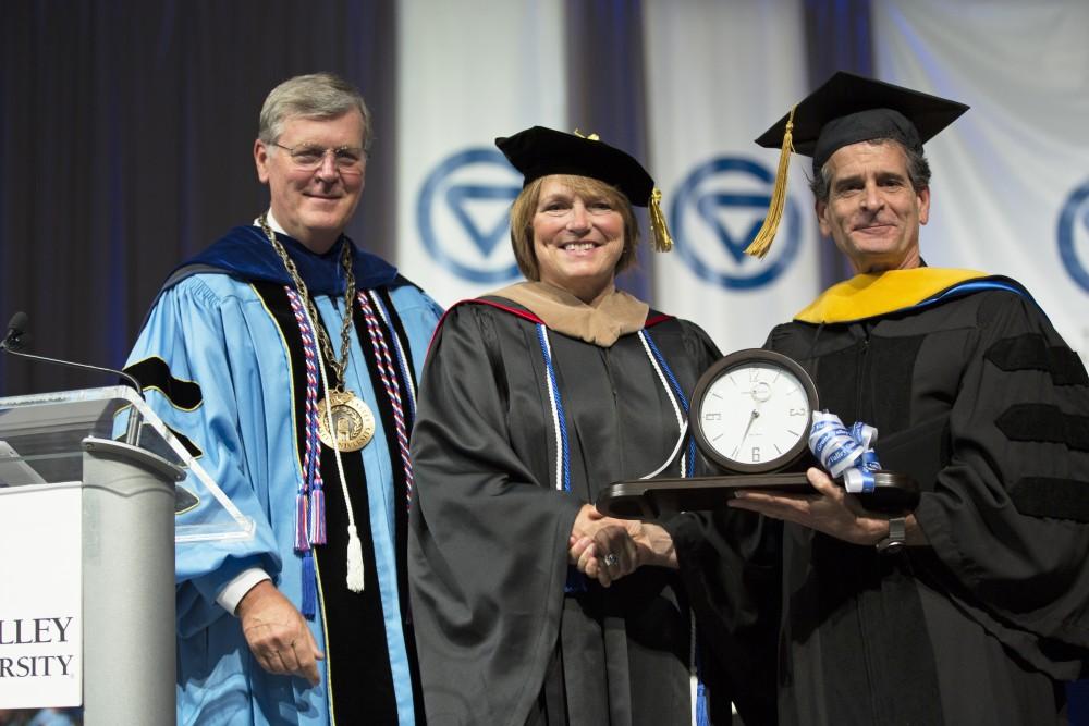GVL / Kevin Sielaff
Dean Kamen, renowned inventor and entrepreneur, is honored with a degree during convocation. Grand Valley kicks off the academic year with their annual convocation ceremonies, held August 29th, 2015 inside the Fieldhouse Arena.  