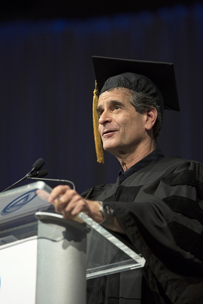 GVL / Kevin Sielaff
Dean Kamen, renowned inventor and entrepreneur, speaks during convocation. Grand Valley kicks off the academic year with their annual convocation ceremonies, held August 29th, 2015 inside the Fieldhouse Arena.  