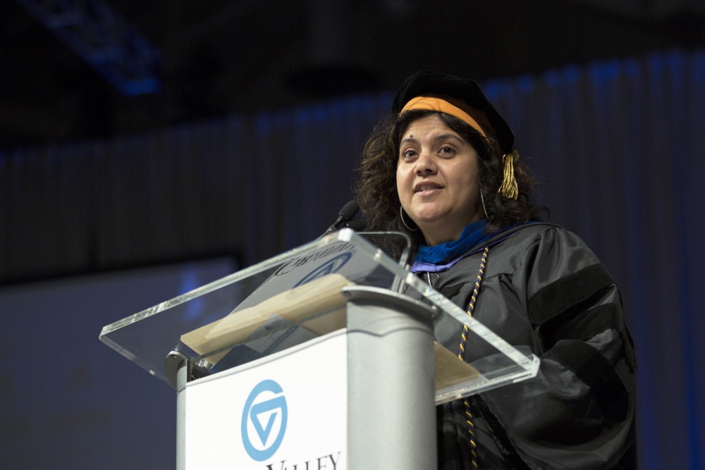 GVL / Kevin Sielaff
Samhita Rhodes, associate professor of engineering, speaks at convocation. Grand Valley kicks off the academic year with their annual convocation ceremonies, held August 29th, 2015 inside the Fieldhouse Arena.  