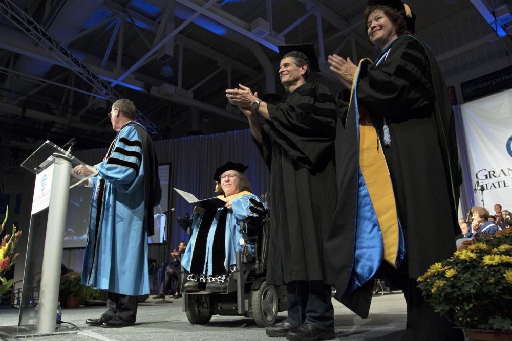 GVL / Kevin Sielaff
Dean Kamen receives an honorary degree during convocation. Grand Valley kicks off the academic year with their annual convocation ceremonies, held August 29th, 2015 inside the Fieldhouse Arena.  