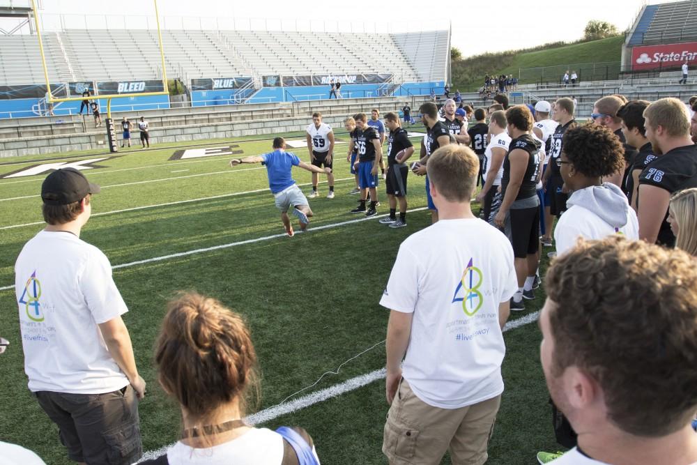 GVL / Kevin Sielaff
Students participate in various games during Fan Fest in order to win miscellanious prizes. The Grand Valley State University athletics department hosts its annual Fan Fest at Lubbers Stadium Thursday, August 28th, 2015. Incoming freshman and athletes alike swarm the football field for games and activities in a "meet and greet" setting. 