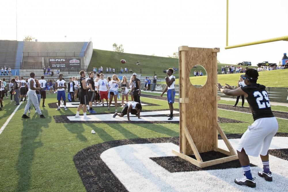 GVL / Kevin Sielaff
Students participate in various games during Fan Fest in order to win miscellanious prizes. The Grand Valley State University athletics department hosts its annual Fan Fest at Lubbers Stadium Thursday, August 28th, 2015. Incoming freshman and athletes alike swarm the football field for games and activities in a "meet and greet" setting. 