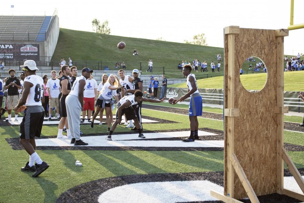 GVL / Kevin Sielaff
Students participate in various games during Fan Fest in order to win miscellanious prizes. The Grand Valley State University athletics department hosts its annual Fan Fest at Lubbers Stadium Thursday, August 28th, 2015. Incoming freshman and athletes alike swarm the football field for games and activities in a "meet and greet" setting. 