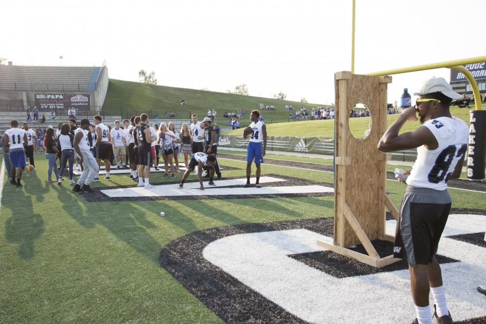 GVL / Kevin Sielaff
Students participate in various games during Fan Fest in order to win miscellanious prizes. The Grand Valley State University athletics department hosts its annual Fan Fest at Lubbers Stadium Thursday, August 28th, 2015. Incoming freshman and athletes alike swarm the football field for games and activities in a "meet and greet" setting. 