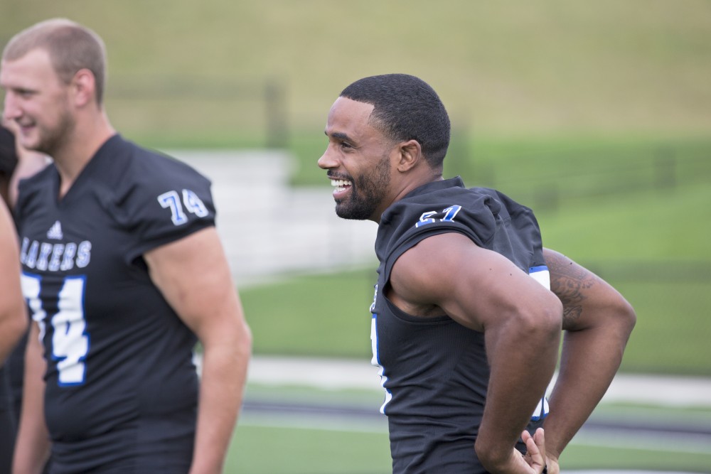 GVL / Kevin Sielaff
The Grand Valley State University football squad gathers for its annual media day Wednesday, August 19th, 2015. The afternoon aimed to promote the highly anticipated 2015 football season, while also making predictions for what the year ahead might hold. Kirk Spencer (27), laughs after the senior class takes their group photo.   