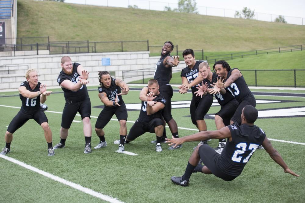 GVL / Kevin Sielaff
The Grand Valley State University football squad gathers for its annual media day Wednesday, August 19th, 2015. The afternoon aimed to promote the highly anticipated 2015 football season, while also making predictions for what the year ahead might hold.  The senior class take their group photo as running back Kirk Spencer (27) flies backward.   