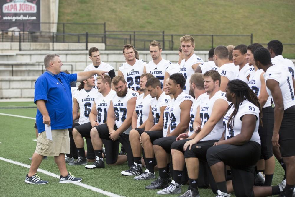 GVL / Kevin Sielaff
The Grand Valley State University football squad gathers for its annual media day Wednesday, August 19th, 2015. The afternoon aimed to promote the highly anticipated 2015 football season, while also making predictions for what the year ahead might hold. Tim Nott, Grand Valley's sports info director for football, directs players as to where they need to stand.   