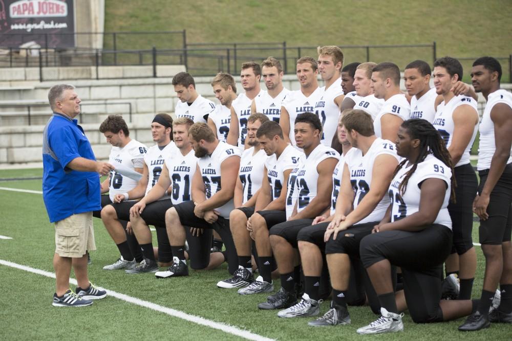 GVL / Kevin Sielaff
The Grand Valley State University football squad gathers for its annual media day Wednesday, August 19th, 2015. The afternoon aimed to promote the highly anticipated 2015 football season, while also making predictions for what the year ahead might hold. Tim Nott, Grand Valley's sports info director for football, directs players as to where they need to stand.     