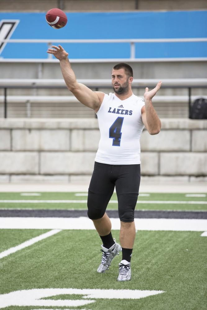 GVL / Kevin Sielaff
The Grand Valley State University football squad gathers for its annual media day Wednesday, August 19th, 2015. The afternoon aimed to promote the highly anticipated 2015 football season, while also making predictions for what the year ahead might hold. Alton Voss (4) tosses a football as media day comes to a close.    