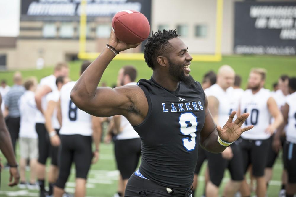 GVL / Kevin Sielaff
The Grand Valley State University football squad gathers for its annual media day Wednesday, August 19th, 2015. The afternoon aimed to promote the highly anticipated 2015 football season, while also making predictions for what the year ahead might hold. Matt Judon (9) throws a pass to Alton Voss (4).   