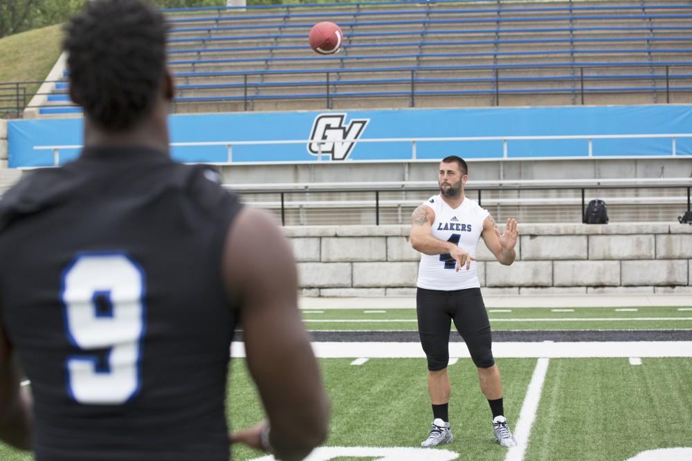 GVL / Kevin Sielaff
The Grand Valley State University football squad gathers for its annual media day Wednesday, August 19th, 2015. The afternoon aimed to promote the highly anticipated 2015 football season, while also making predictions for what the year ahead might hold. Alton Voss (4) throws a pass across the field.   