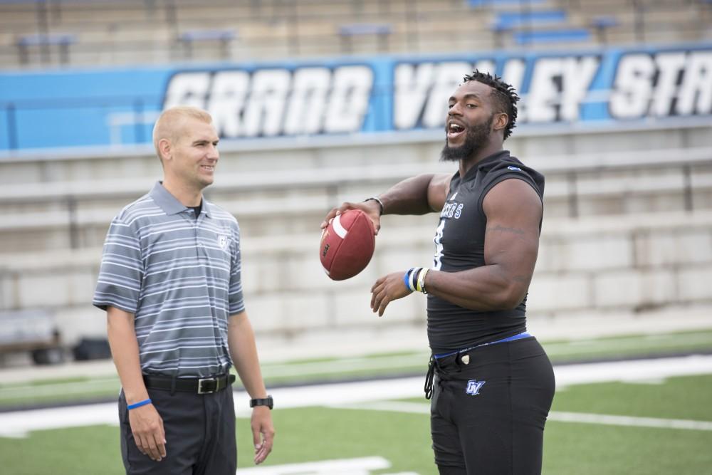 GVL / Kevin Sielaff
The Grand Valley State University football squad gathers for its annual media day Wednesday, August 19th, 2015. The afternoon aimed to promote the highly anticipated 2015 football season, while also making predictions for what the year ahead might hold. Matt Judon (9) jokes as he throws a pass downfield.   