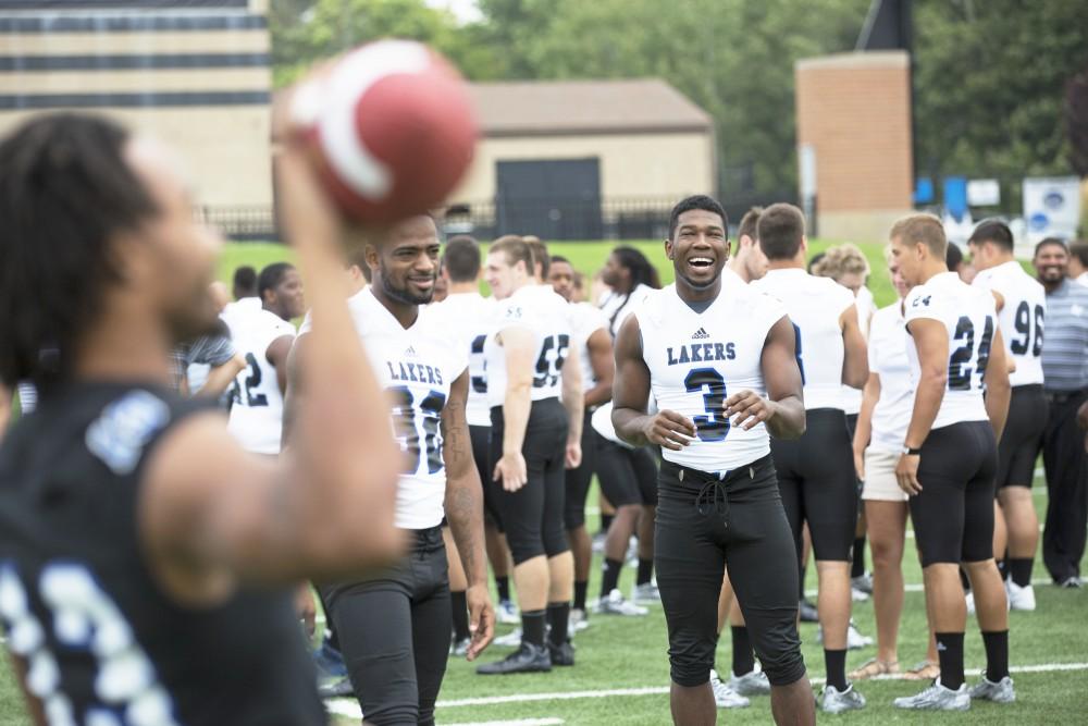 GVL / Kevin Sielaff
The Grand Valley State University football squad gathers for its annual media day Wednesday, August 19th, 2015. The afternoon aimed to promote the highly anticipated 2015 football season, while also making predictions for what the year ahead might hold. Brandon Bean (3) jokes as he looks to receive a pass.   