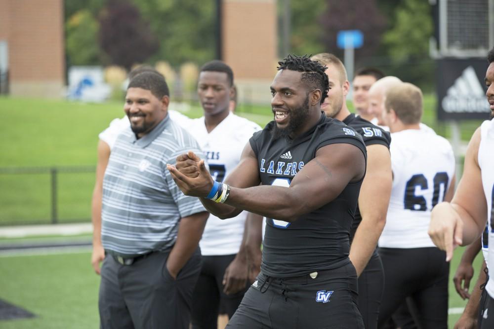 GVL / Kevin Sielaff
The Grand Valley State University football squad gathers for its annual media day Wednesday, August 19th, 2015. The afternoon aimed to promote the highly anticipated 2015 football season, while also making predictions for what the year ahead might hold. Matt Judon (9) jokes with his teammates.   