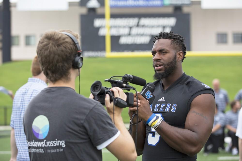 GVL / Kevin Sielaff
The Grand Valley State University football squad gathers for its annual media day Wednesday, August 19th, 2015. The afternoon aimed to promote the highly anticipated 2015 football season, while also making predictions for what the year ahead might hold. Matt Judon (9) answers questions for Grand Valley's sports info department. 