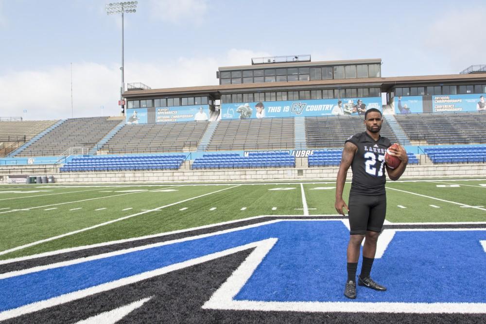 GVL / Kevin Sielaff
The Grand Valley State University football squad gathers for its annual media day Wednesday, August 19th, 2015. The afternoon aimed to promote the highly anticipated 2015 football season, while also making predictions for what the year ahead might hold. Senior running back Kirk Spencer (27) poses for his final media day photos. 