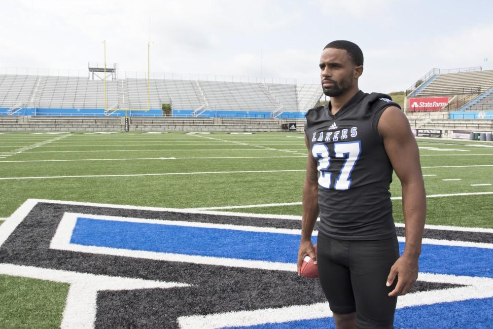 GVL / Kevin Sielaff
The Grand Valley State University football squad gathers for its annual media day Wednesday, August 19th, 2015. The afternoon aimed to promote the highly anticipated 2015 football season, while also making predictions for what the year ahead might hold.  Senior running back Kirk Spencer (27) poses for his final media day photos.   