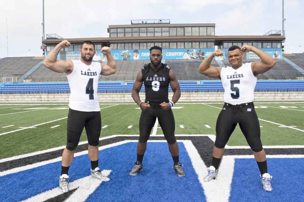 GVL / Kevin Sielaff
The Grand Valley State University football squad gathers for its annual media day Wednesday, August 19th, 2015. The afternoon aimed to promote the highly anticipated 2015 football season, while also making predictions for what the year ahead might hold.  Alton Voss (4), Matt Judon (9), and De'Ondre Hogan (5) all pose for a media day photo. 