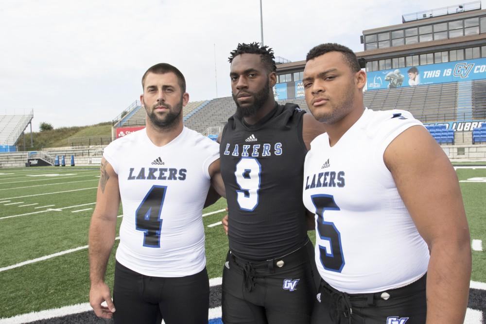 GVL / Kevin Sielaff
The Grand Valley State University football squad gathers for its annual media day Wednesday, August 19th, 2015. The afternoon aimed to promote the highly anticipated 2015 football season, while also making predictions for what the year ahead might hold.  Alton Voss (4), Matt Judon (9), and De'Ondre Hogan (5) all pose for a media day photo.  