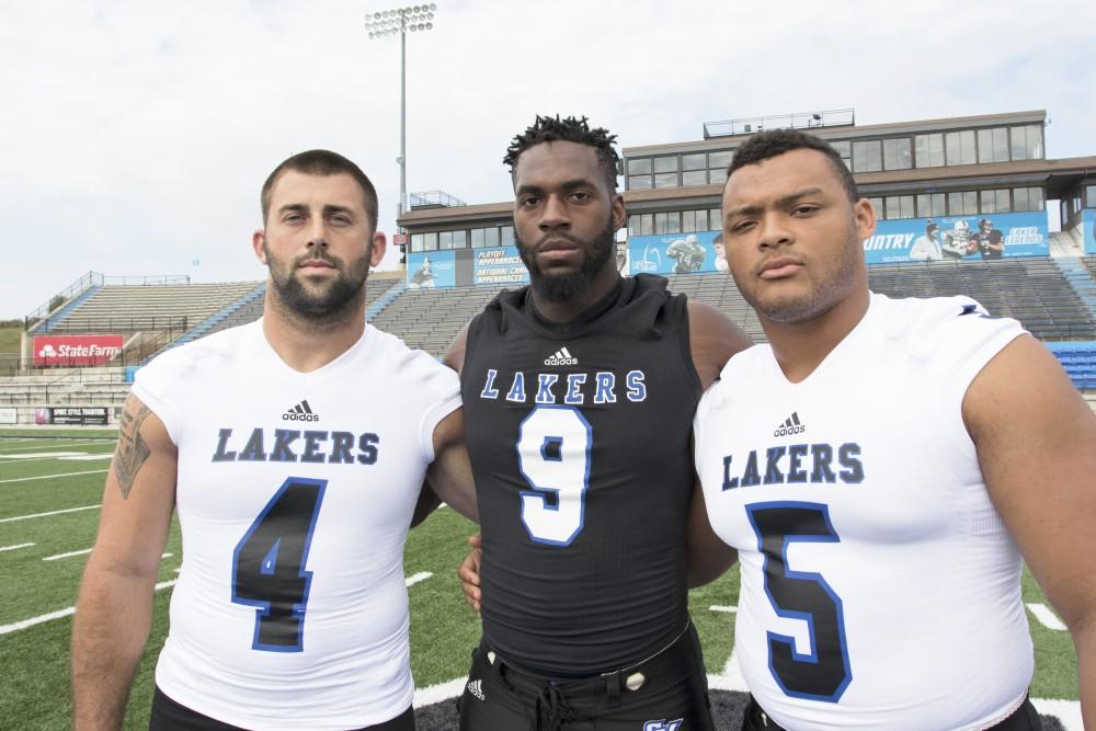 GVL / Kevin Sielaff
The Grand Valley State University football squad gathers for its annual media day Wednesday, August 19th, 2015. The afternoon aimed to promote the highly anticipated 2015 football season, while also making predictions for what the year ahead might hold.  Alton Voss (4), Matt Judon (9), and De'Ondre Hogan (5) all pose for a media day photo.  