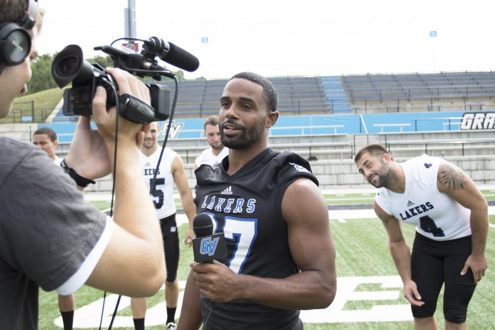 GVL / Kevin Sielaff
The Grand Valley State University football squad gathers for its annual media day Wednesday, August 19th, 2015. The afternoon aimed to promote the highly anticipated 2015 football season, while also making predictions for what the year ahead might hold. Kirk Spencer (27) does a TV outro for Grand Valley's sports info department.   